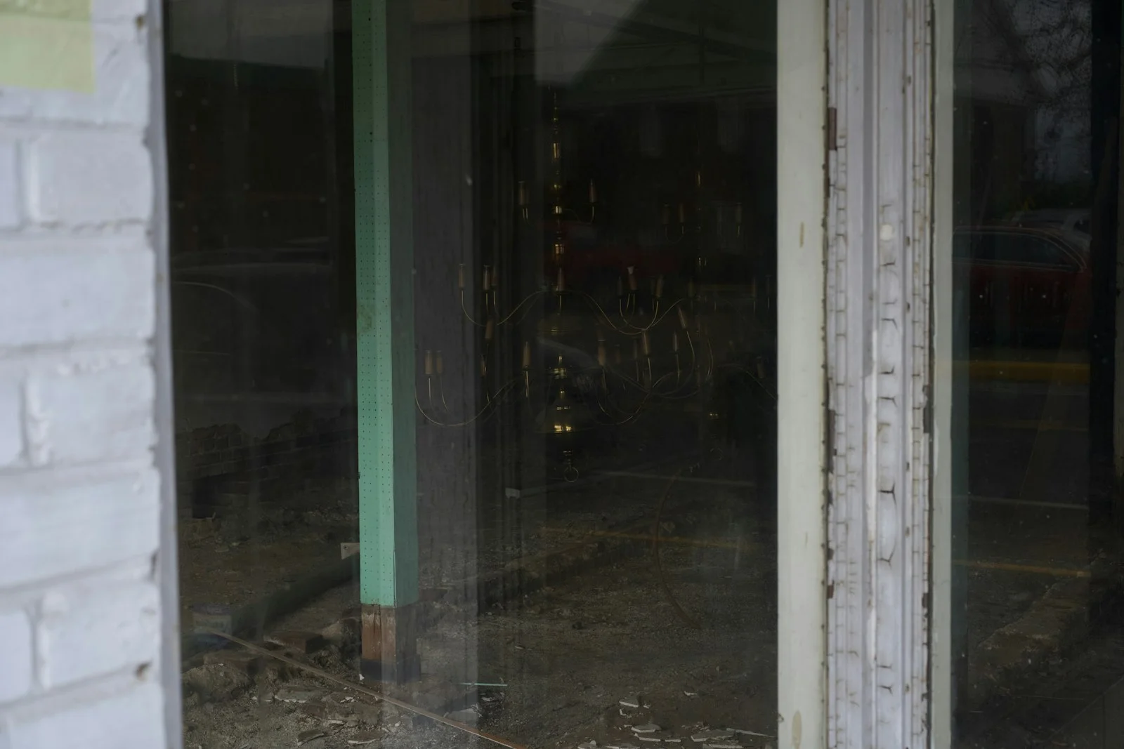 a cat sitting in the window of a store a cat sitting in the window of a store